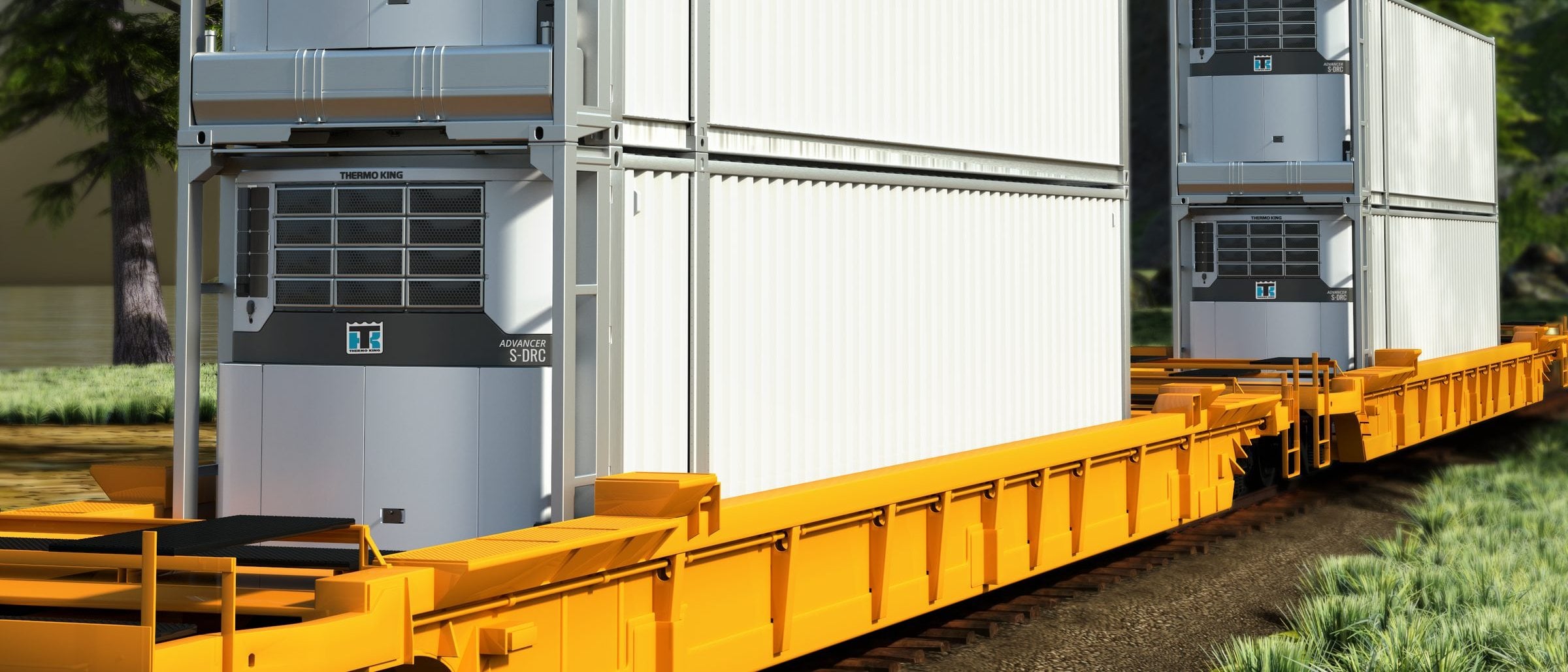 Thermo King Advancer S-DRC units on double-stacked refrigerated containers, riding a yellow rail well car
