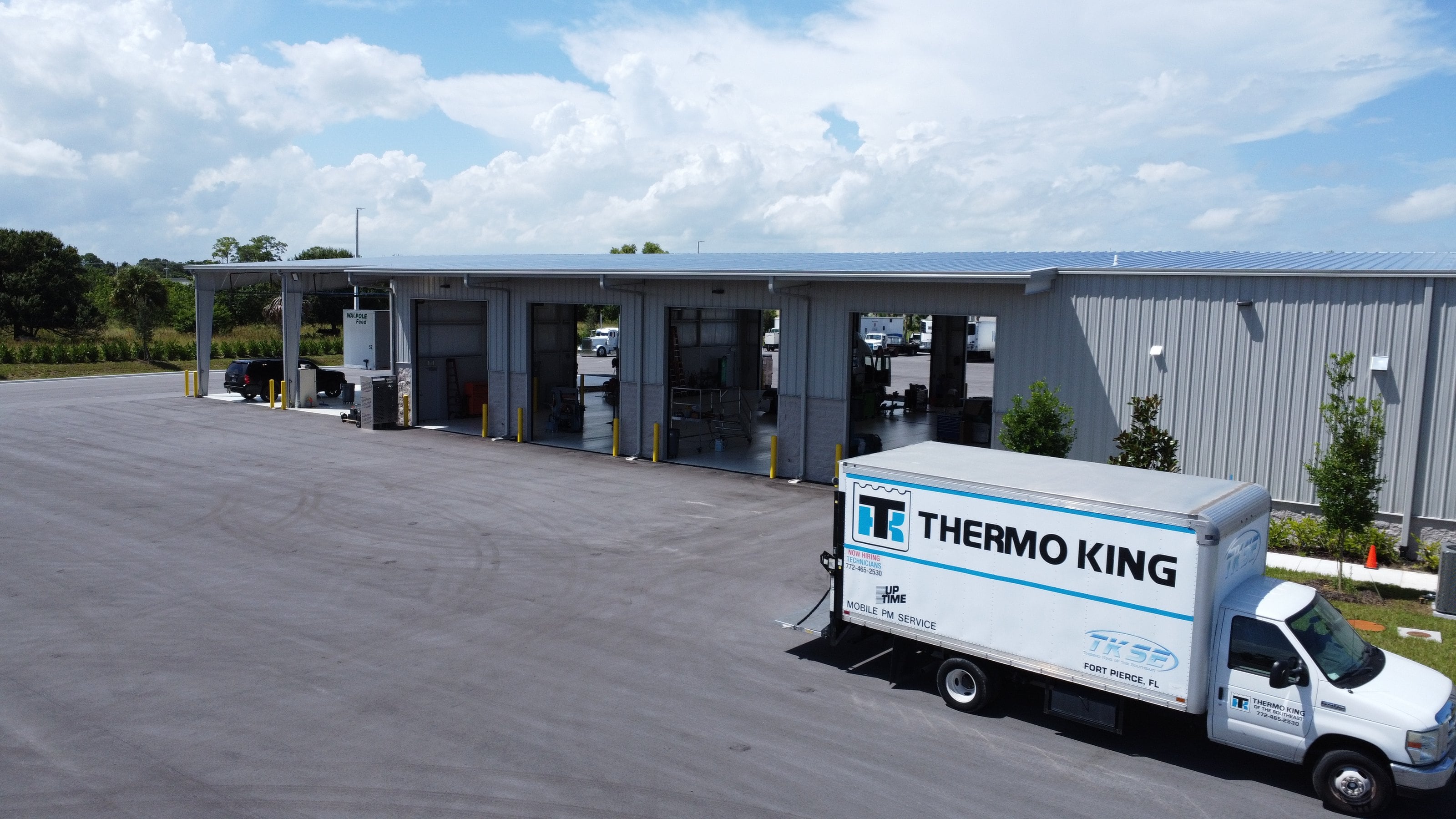 A TKSE Thermo King mobile service truck outside the Fort Pierce shop's service bays