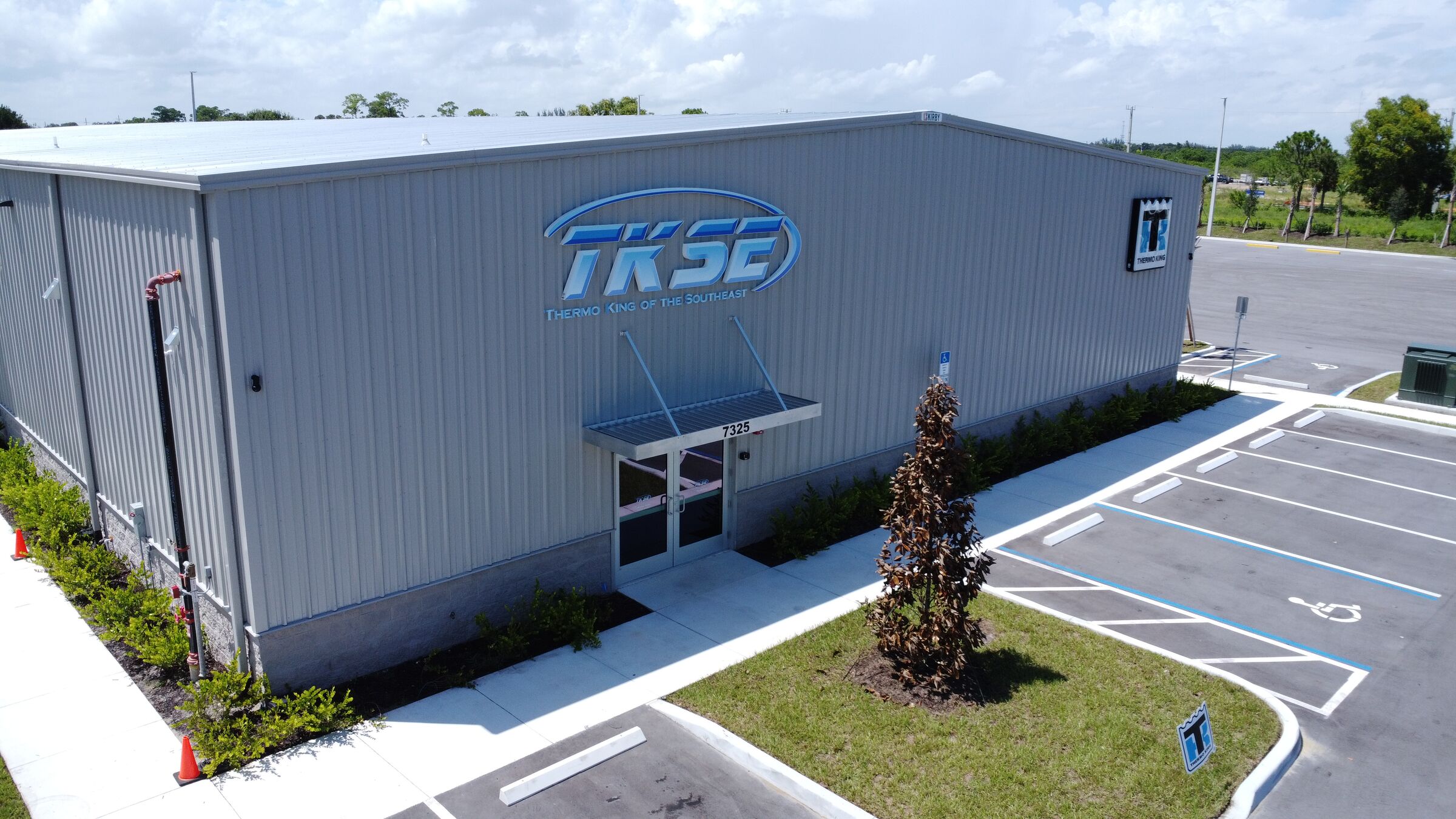 The TKSE Fort Pierce building from the air, with the TKSE sign over the entrance at 7325 Pruitt Research Road