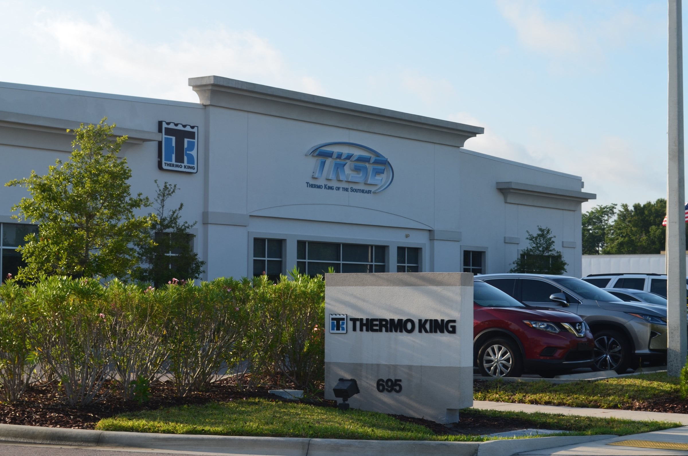 The front of TKSE's Winter Garden shop at 695 Garden Commerce Parkway, with the TKSE and Thermo King signs on the building and a Thermo King sign out front