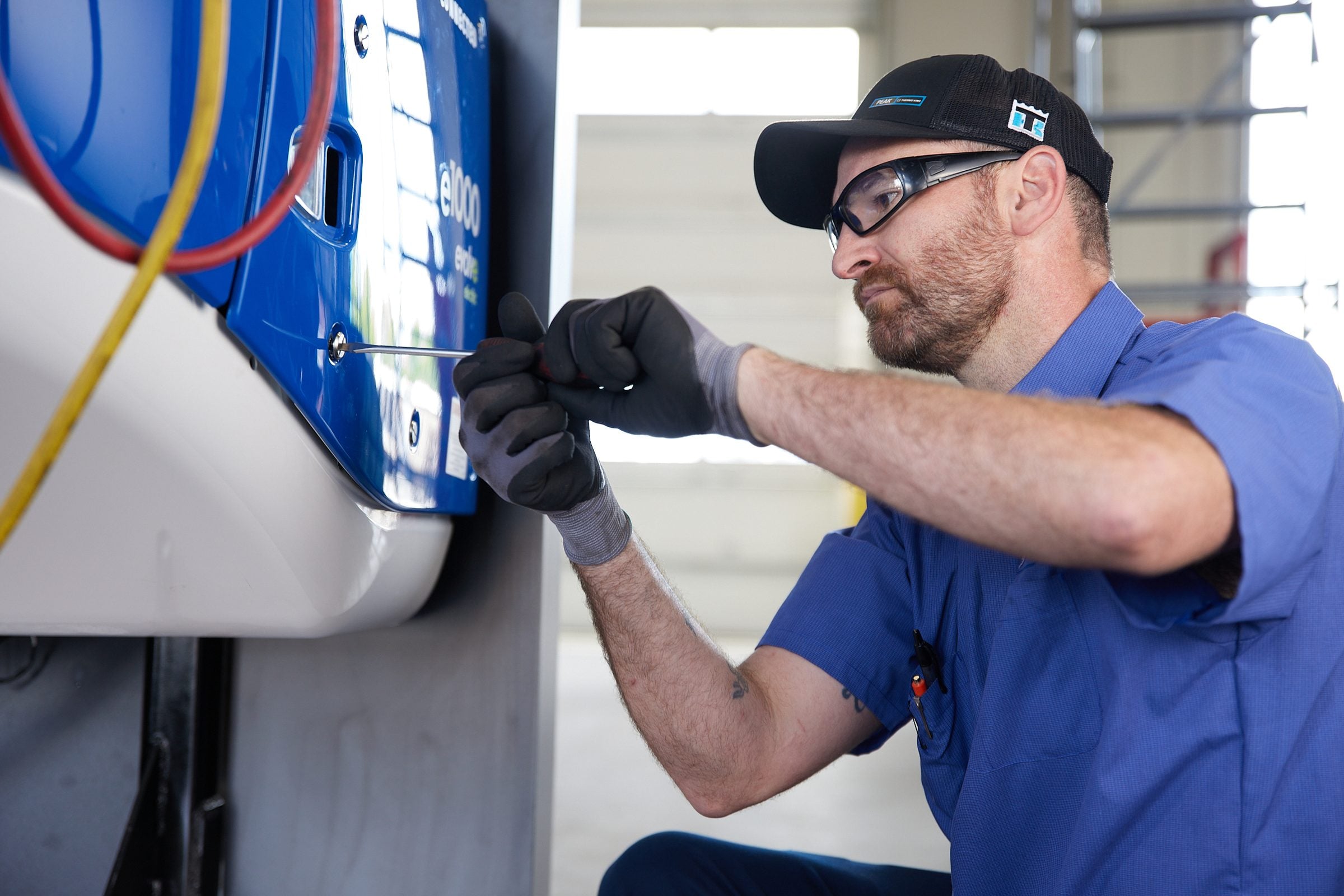 A technician working on a Thermo King unit